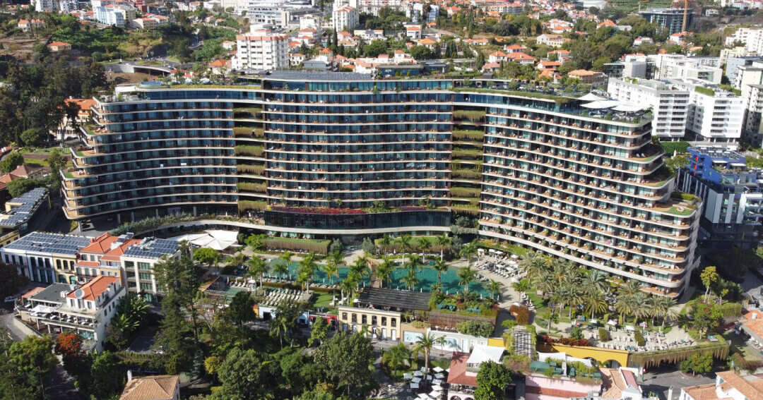 A modern and lavish hotel featuring spacious rooms with elegant decor, infinity pools with breathtaking ocean views, and premium spa services offering rejuvenating treatments.