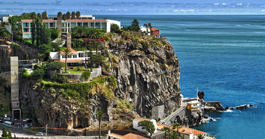A minimalist and contemporary hotel set on a clifftop with breathtaking ocean views, featuring an infinity pool, spa facilities, and intimate dining experiences.